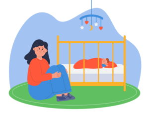 Madre sentada triste y desolada al lado de la cuna del bebe para ilustrar el articulo prevenir el apego desorganizado